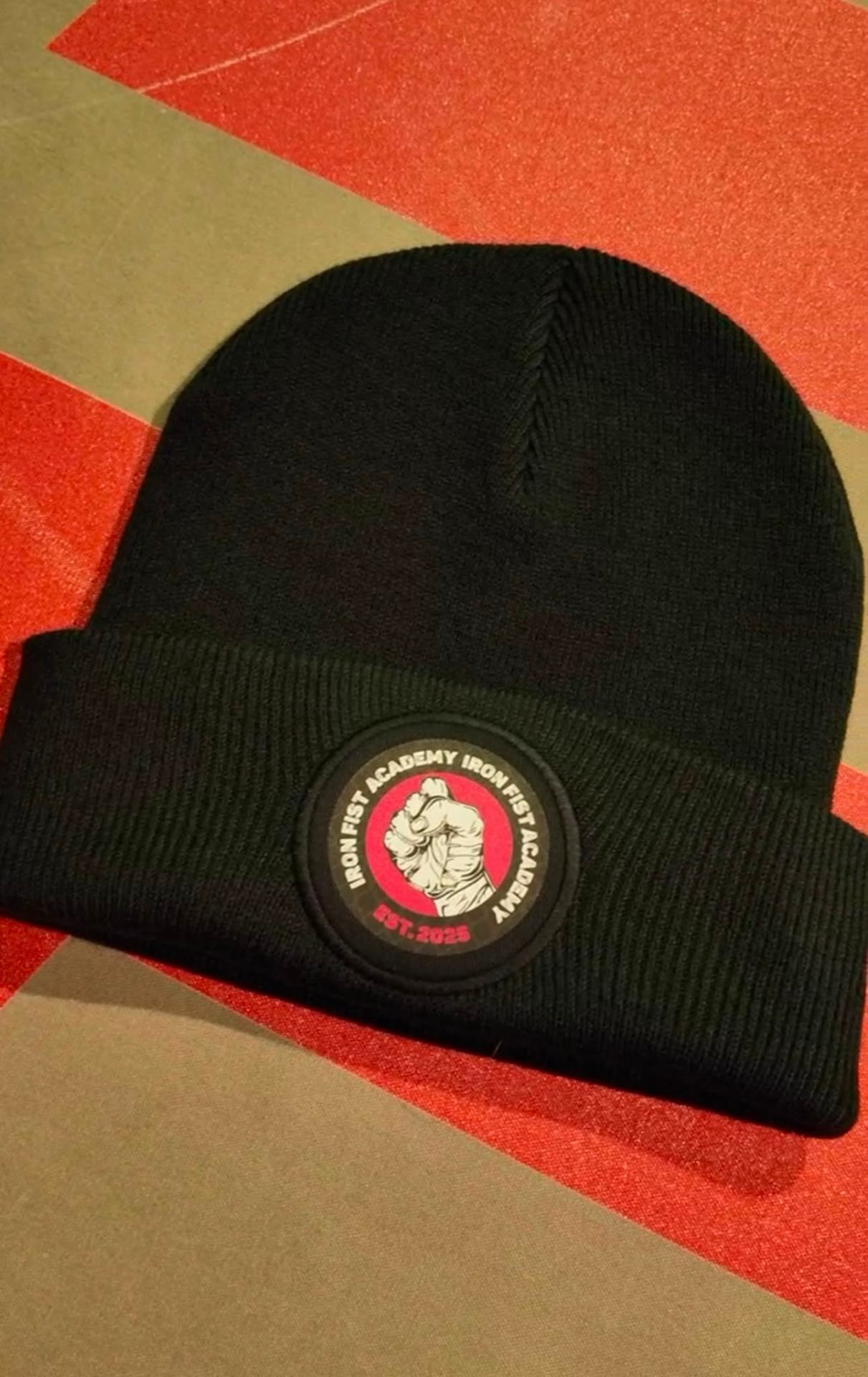 Iron Fist Academy black beanie with pink fist patch